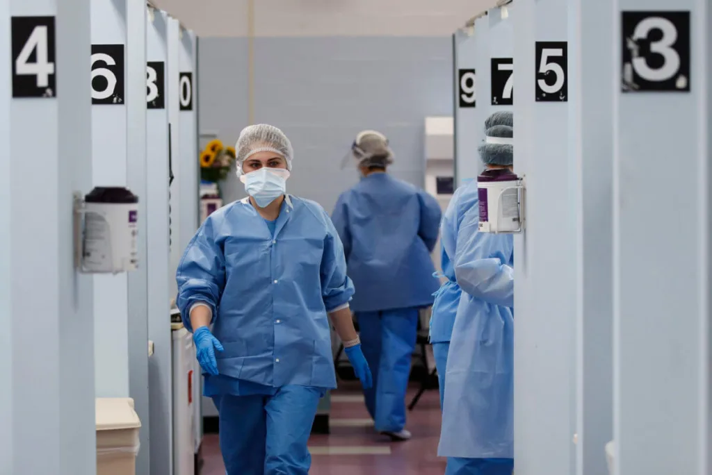 Medical personnel in the COVID-19 medical screening annex at NYC Health + Hospitals Metropolitan in New York. (AP Photo/John Minchillo)