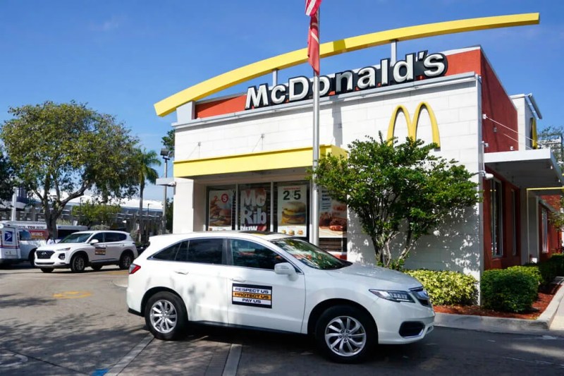caravans of fast food workers circling McDonald's in demands for an increase in minimum wage