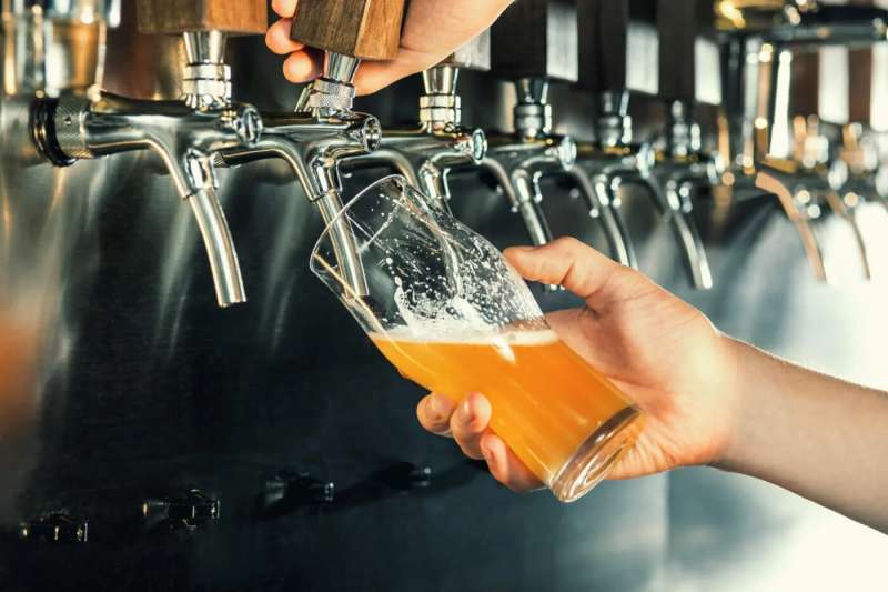 someone pouring a beer