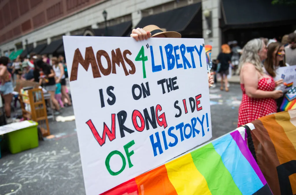 New school board president sworn in on stack of banned books after defeating Moms for Liberty