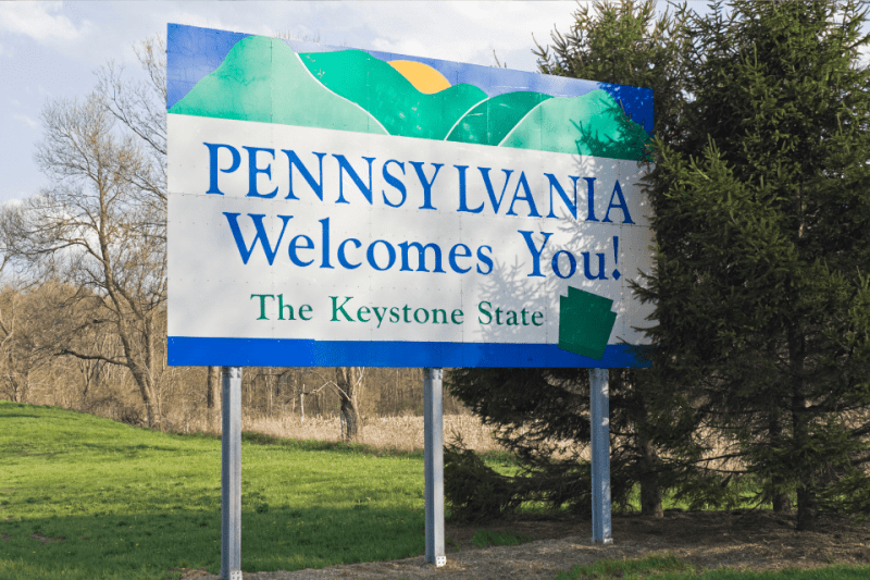 Pennsylvania Welcomes You sign on the side of a highway.