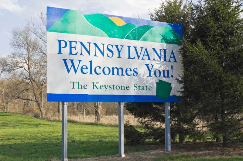 Pennsylvania Welcomes You sign on the side of a highway.