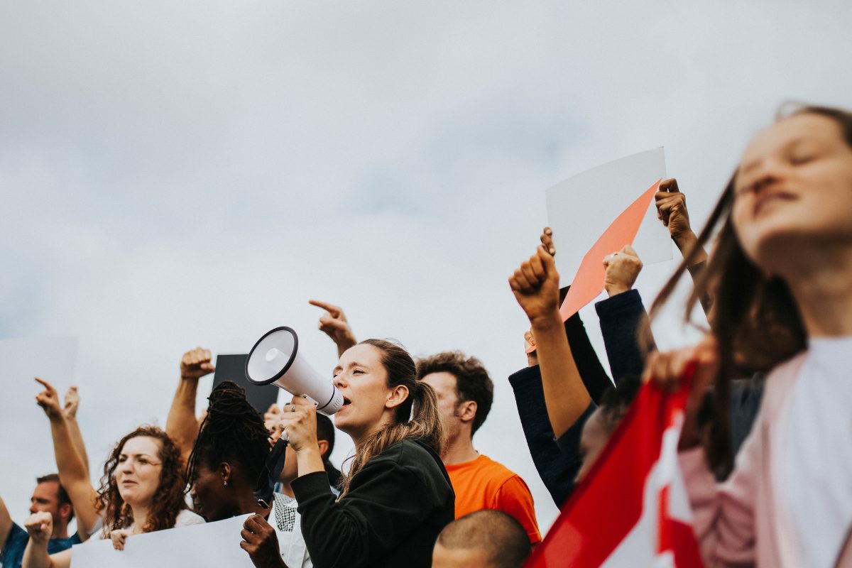 Opinion The Power of Participation Engaging in Democracy Beyond the Ballot A group of youth protesting as a powerful act of civic engagement beyond the ballot
