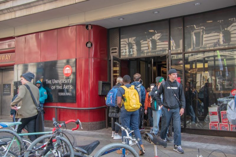 Students are seen entering and leaving via the front door of The University of the Arts on Broad Street in Center City Philadelphia.