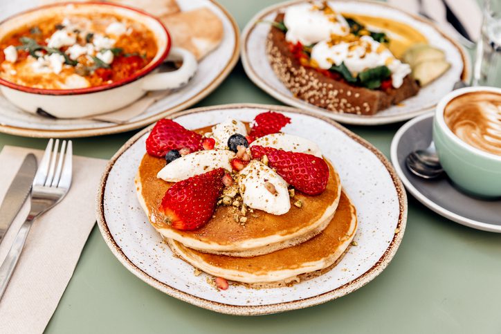 Pancakes with strawberries for brunch at a cafe