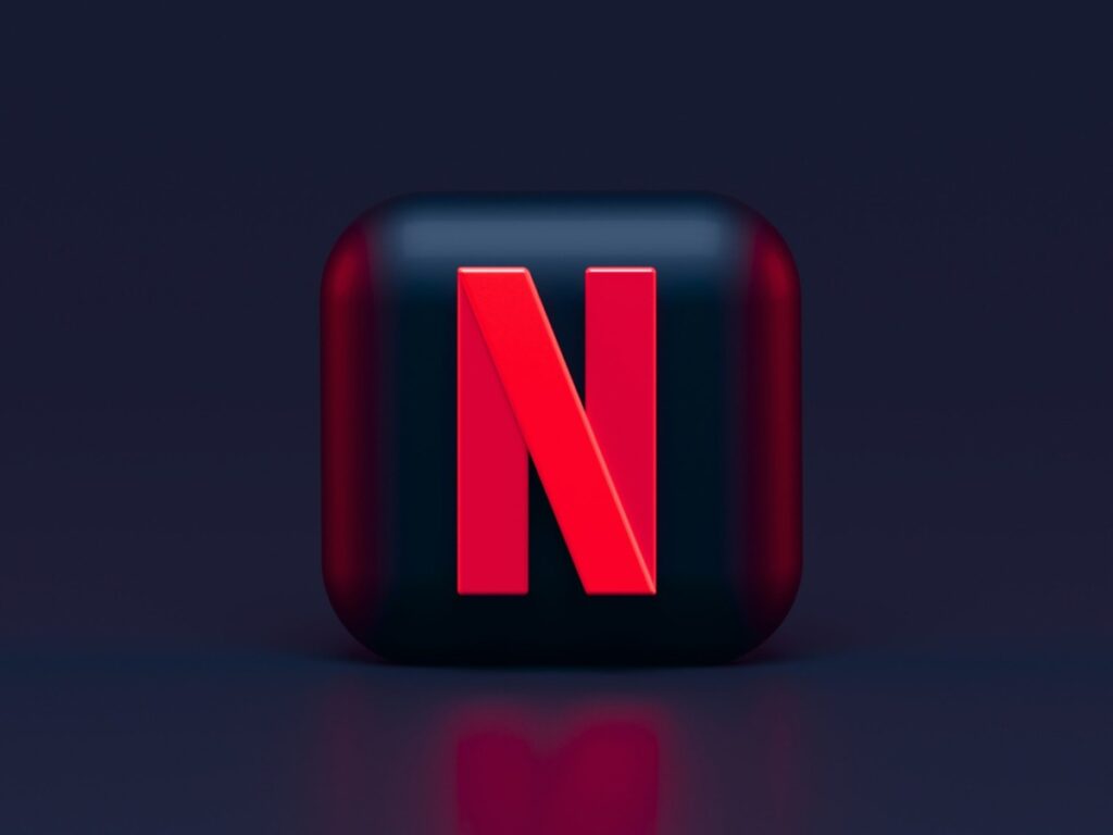 Netflix logo against black backdrop.