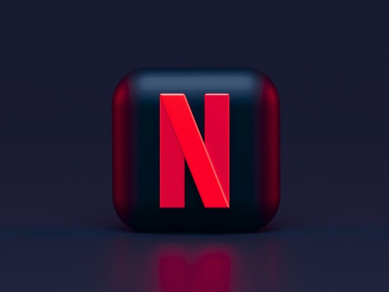 Netflix logo against black backdrop.
