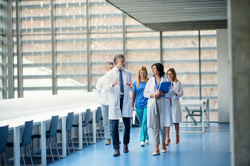 Doctors walking through a hospital hallway.