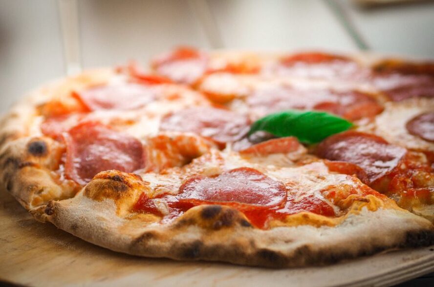 A traditional pizza hot out the oven.