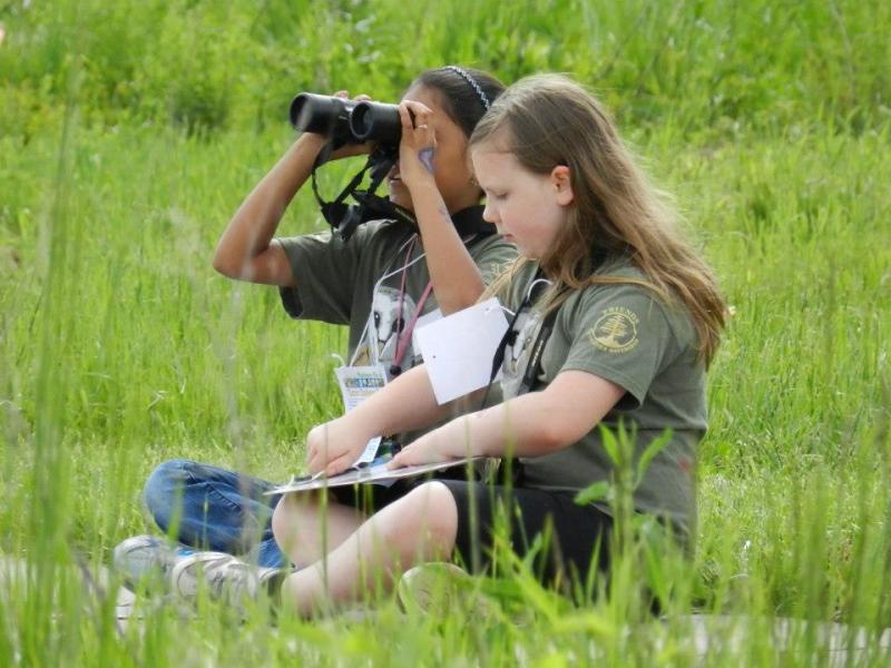 young birders outside looking for birds