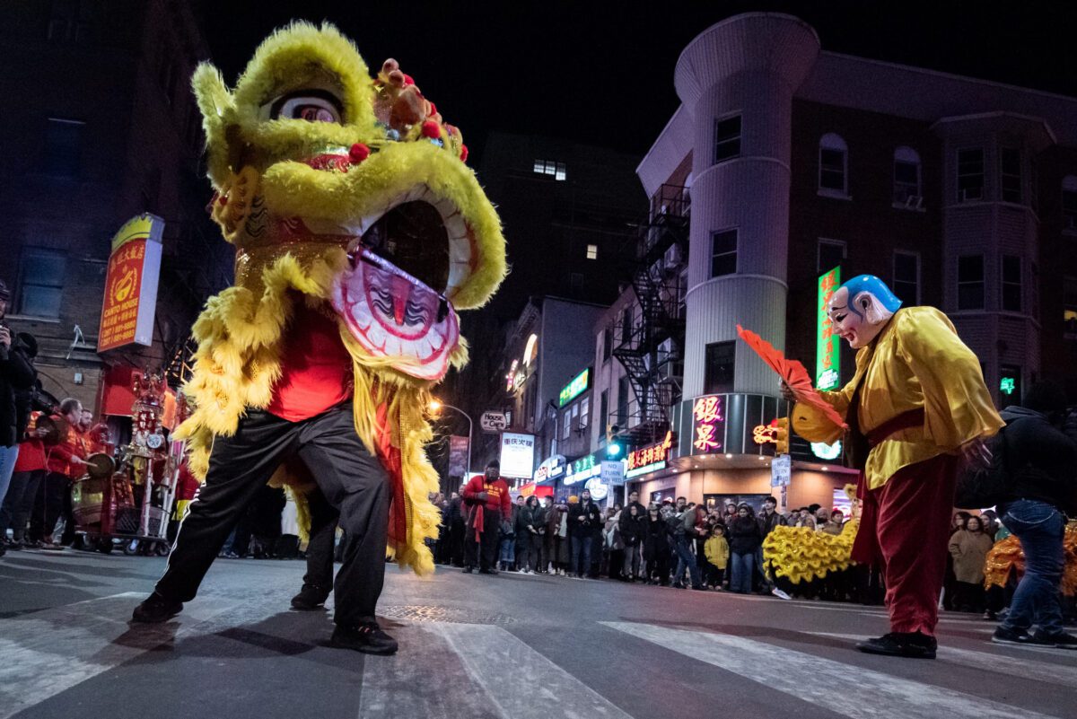 A parade in the Chinatown neighborhood of Philadelphia celebrates the eve of Lunar New Year, on Tuesday, January 28, 2024, with dancing lions led by the Philadelphia Suns, who performed for hundreds of people attending the latenight festivities.