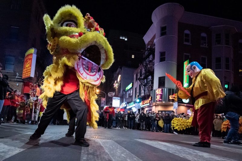 A parade in the Chinatown neighborhood of Philadelphia celebrates the eve of Lunar New Year, on Tuesday, January 28, 2024, with dancing lions led by the Philadelphia Suns, who performed for hundreds of people attending the latenight festivities.