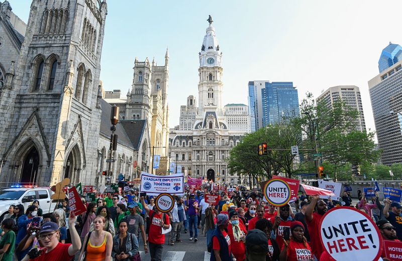 People march near Philadelphia City Hall during the "For the Workers, Not the Billionaires May Day Rally" in Philadelphia, Pennsylvania on May 1, 2025. US Senator Bernie Sanders addressed the protesters who marched and participated in an act of civil disobedience.