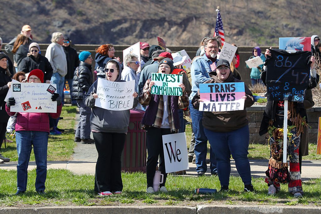 SUNBURY, PENNSYLVANIA, UNITED STATES - 2026/03/28: Protesters gathered at Riverfront Park for a "No Kings" protest against the Trump administration and its policies; participants held hand-lettered placards and American flags. Organizers said the local rally was one of more than 3,300 sister demonstrations held nationwide.