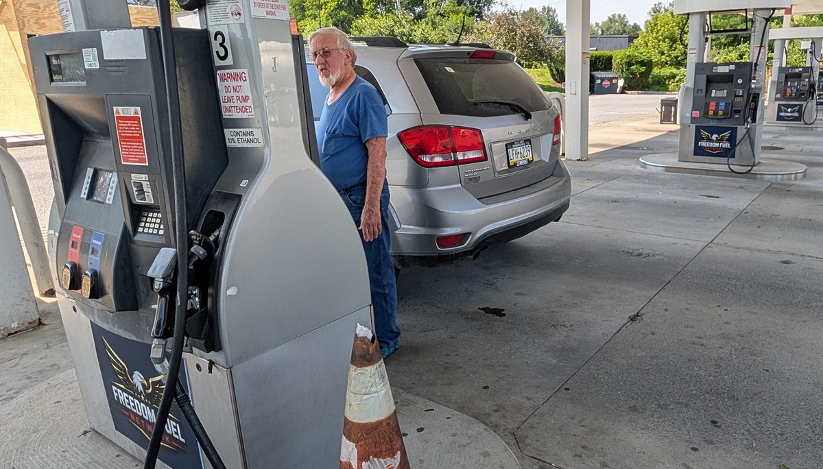 A man pumps Freedom Fuel