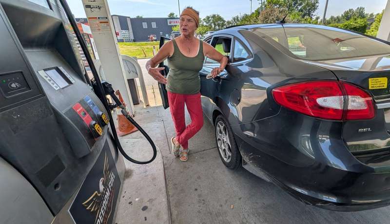 A woman pumps Freedom Fuel