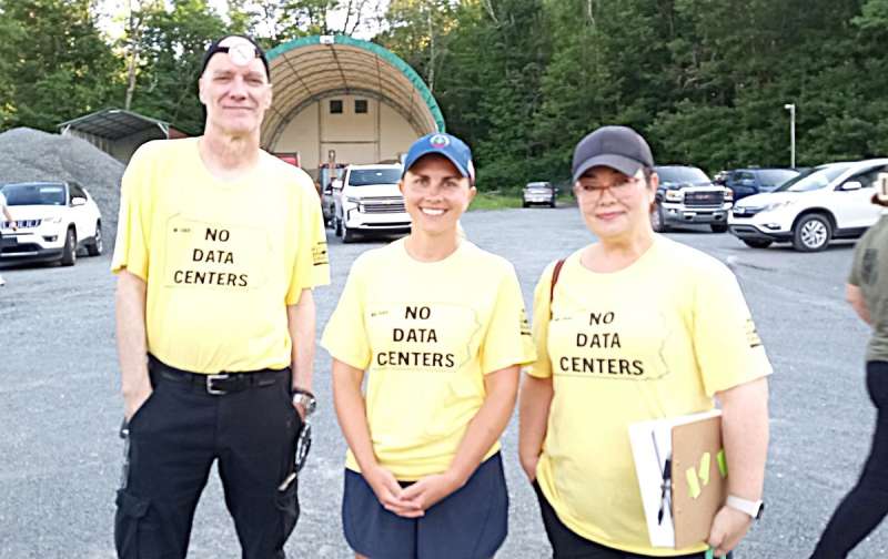 People sporting T-shirts opposing the proposed Clinton Township data center