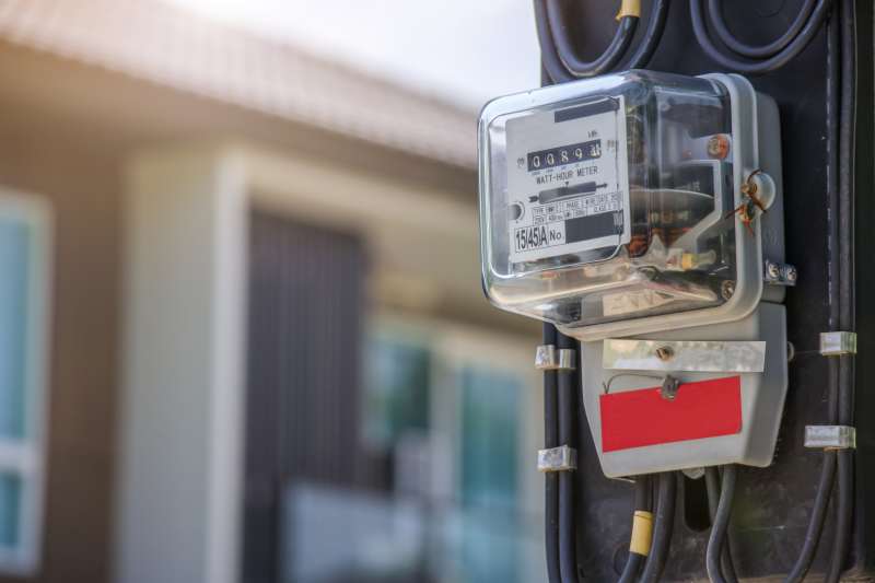 power box, which measures usage for electric bills, in front of house