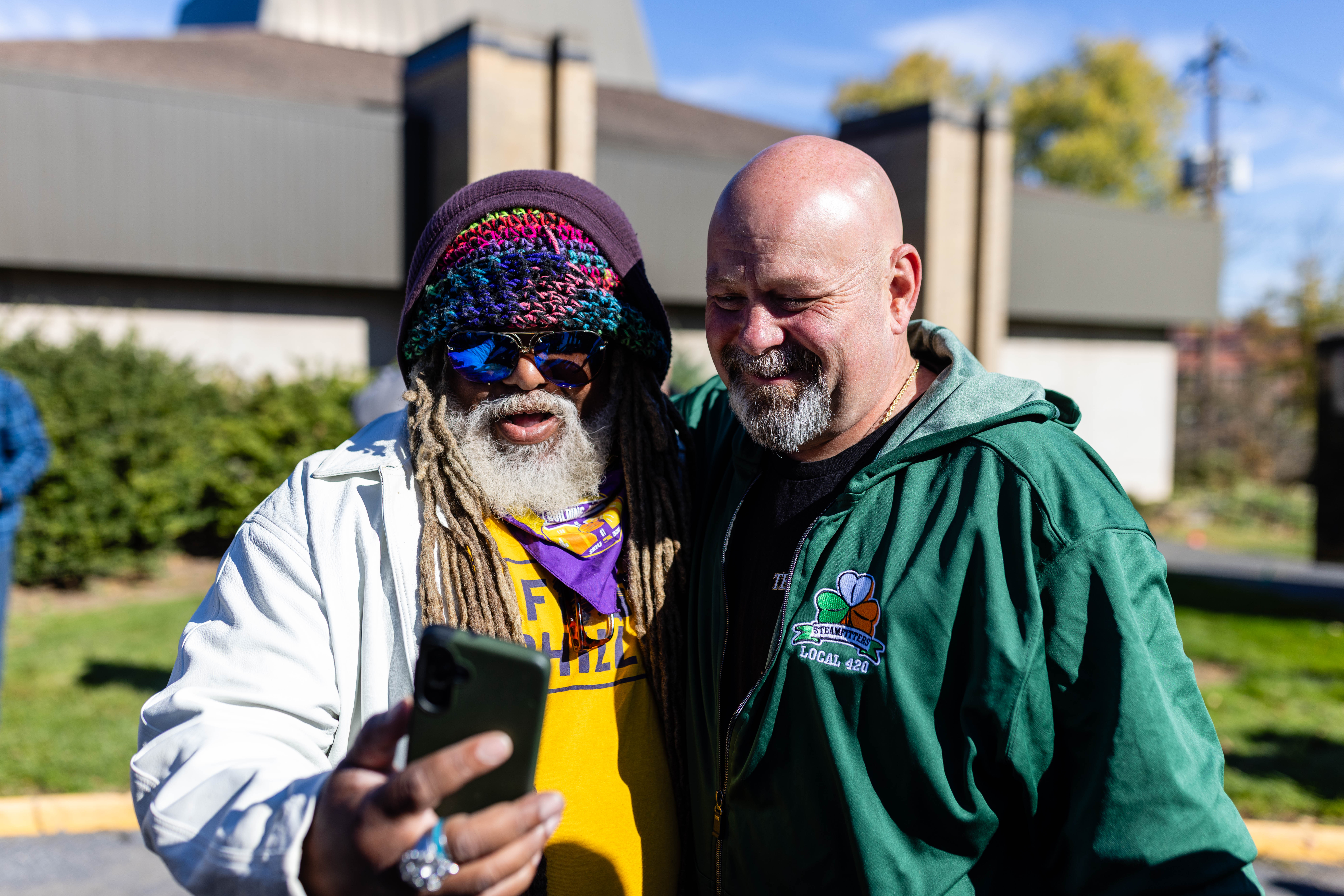 Bob Brooks taking a selfie with a SEIU member (Sean Kitchen / The Keystone)
